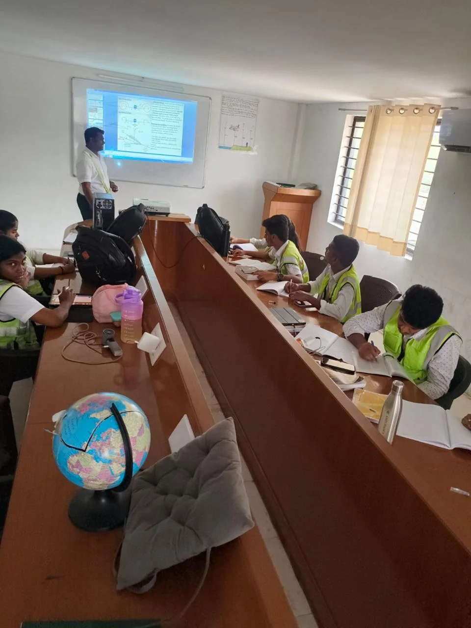 Students discussing aviation coursework together in a classroom
