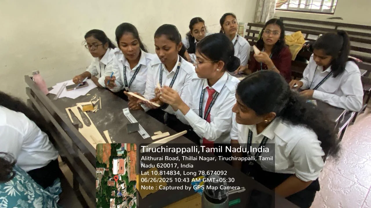 A group of aviation students working together on a model aircraft activity