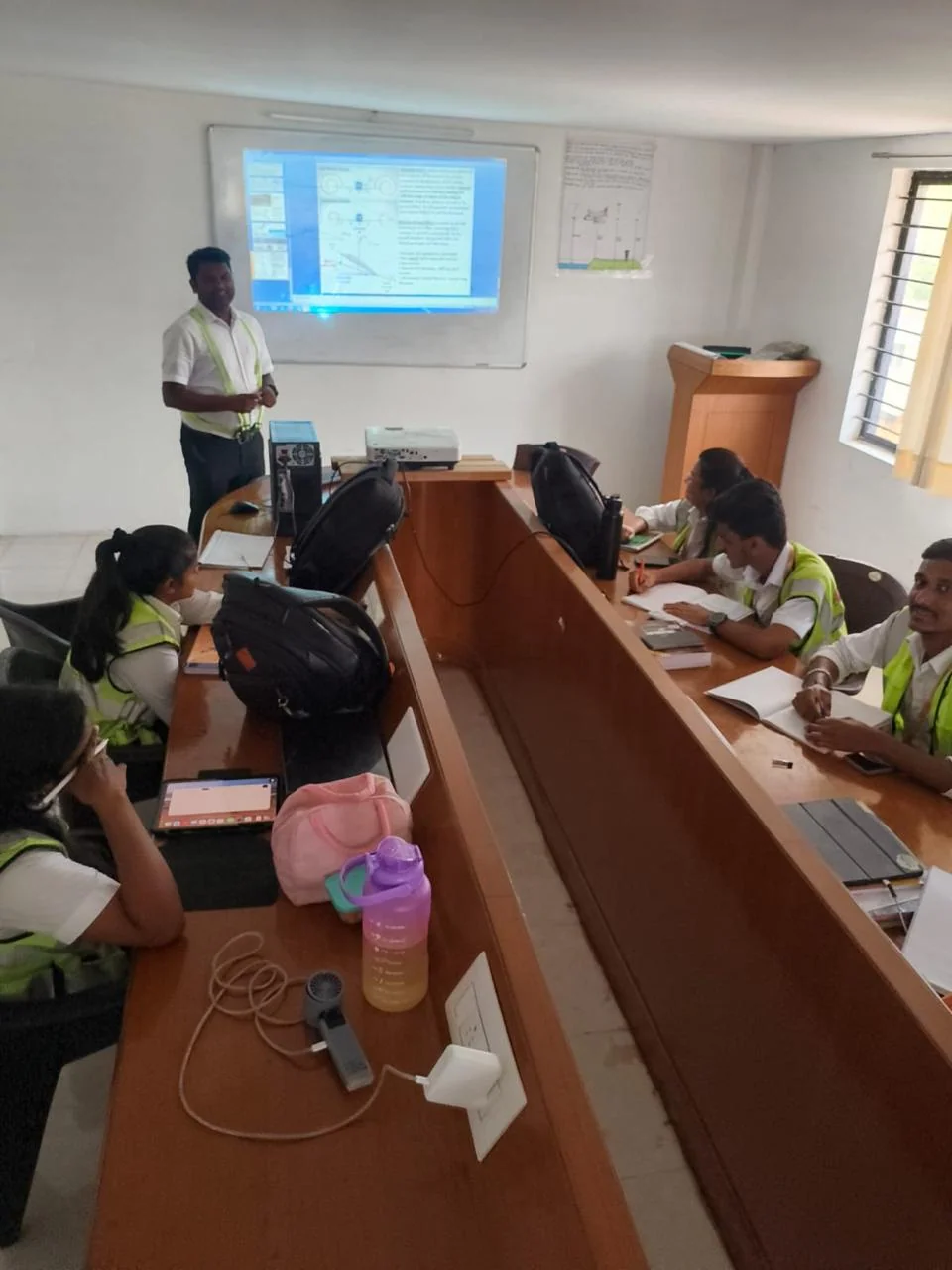 Instructor teaching aviation theory to students in a classroom